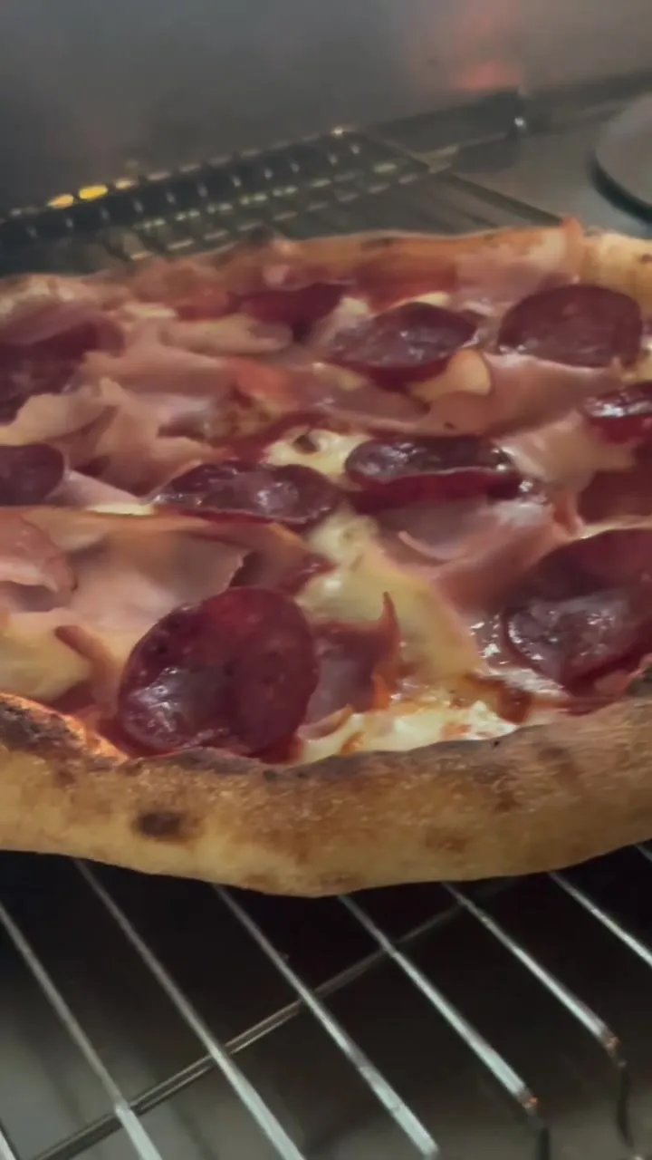 The Smoky fresh out of the oven on the rack, ham, pepperoni and chorizo